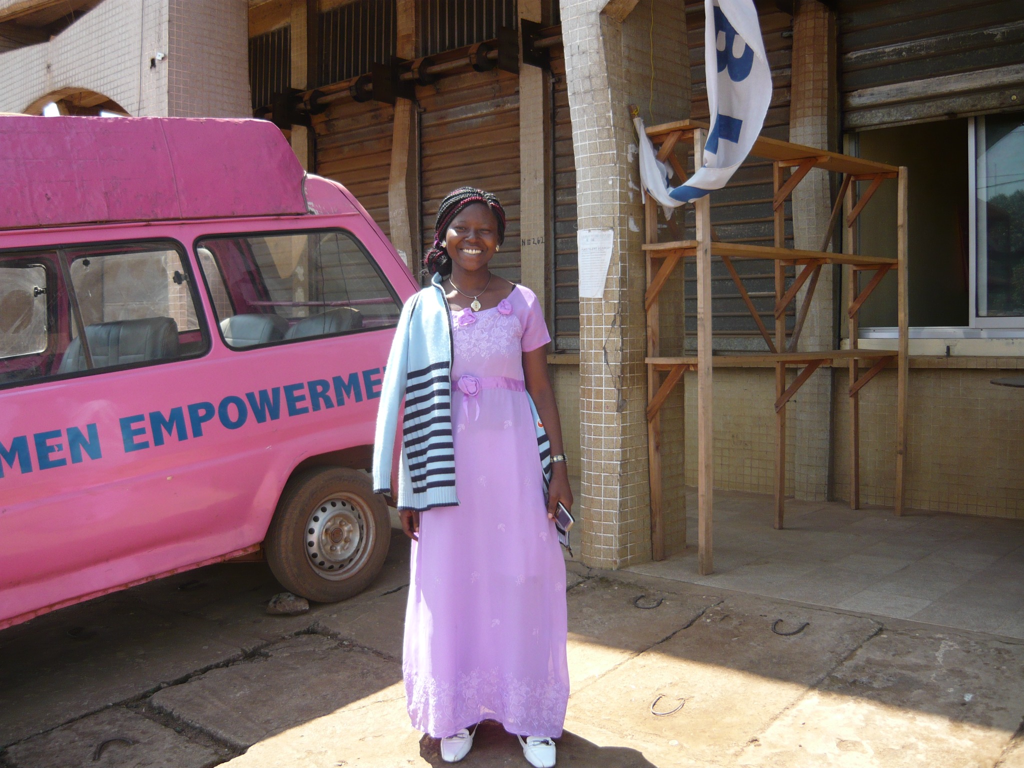 Woman in pink beside an outreach van